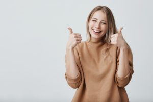 happy woman giving thumbs-up